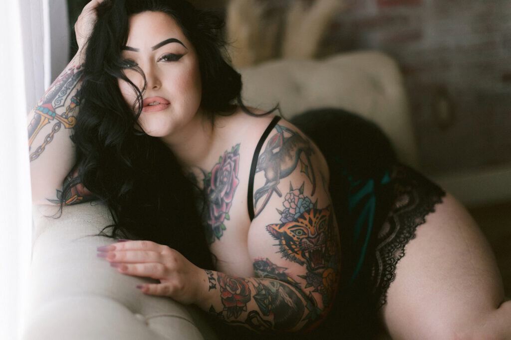Northern California boudoir photography client showcasing her unique style with tattoos and lingerie.