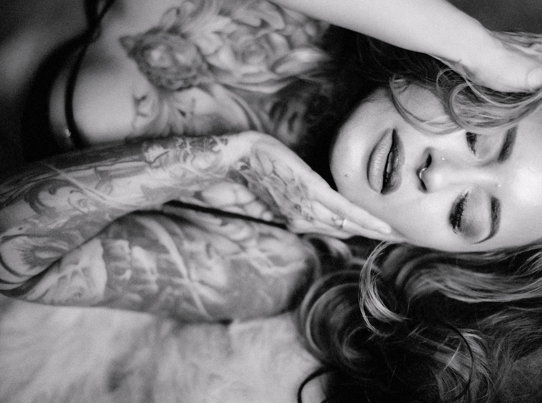 Tattooed woman at a boudoir photoshoot in Sacramento by Heather Elizabeth Portraits
